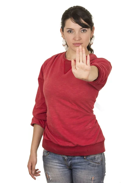 Bella giovane ragazza che indossa top rosso posa gesturing stop con mano — Foto Stock