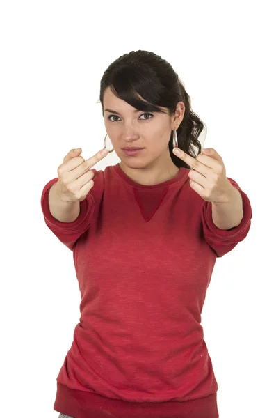 Pretty young girl wearing red top posing showing middle finger — Stock Photo, Image