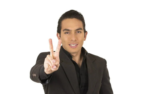 Handsome young man wearing a suit posing gesturing peace sign — Stock Photo, Image