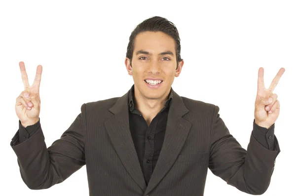 Handsome young man wearing a suit posing gesturing peace sign — Stock Photo, Image