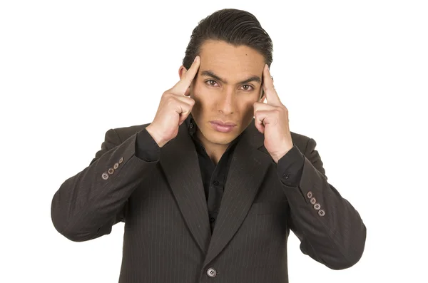 Handsome young man wearing a suit posing with fingers on head — Stock Photo, Image