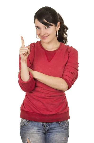 かなり若い女の子身に着けている赤いトップを指すポーズ — ストック写真