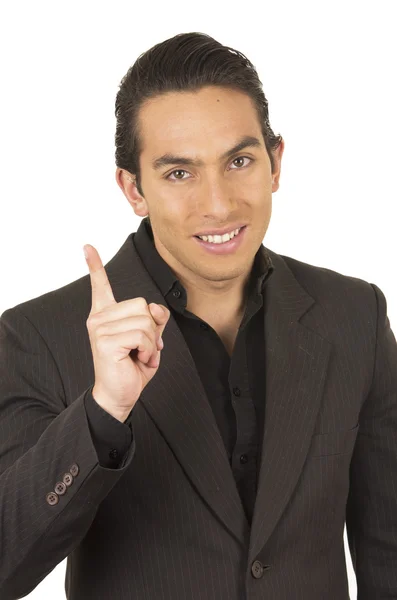 Όμορφος νεαρός άνδρας, φορώντας ένα κοστούμι που παρουσιάζουν εκμετάλλευση δάχτυλο επάνω — Φωτογραφία Αρχείου