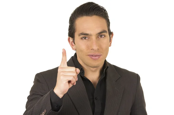 Handsome young man wearing a suit posing holding finger up — Stock Photo, Image