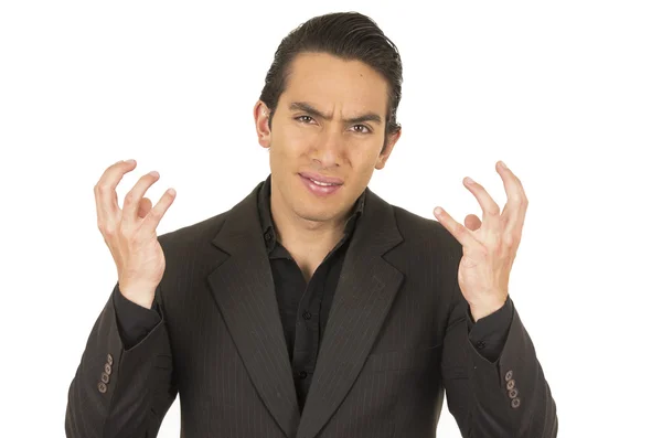 Handsome young man wearing a suit gesturing anger — Stock Photo, Image