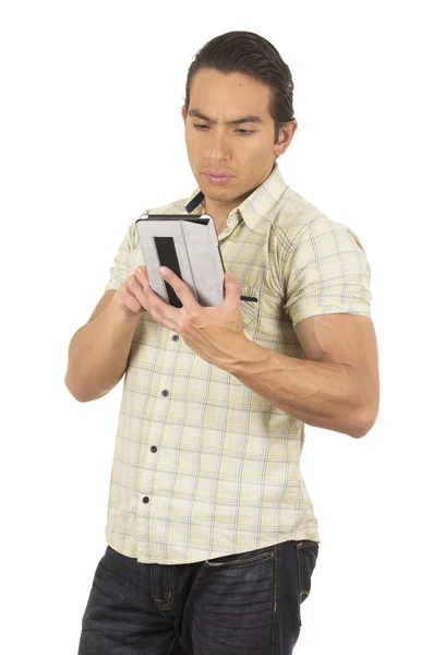 Young handsome hispanic man posing using tablet Stock Image