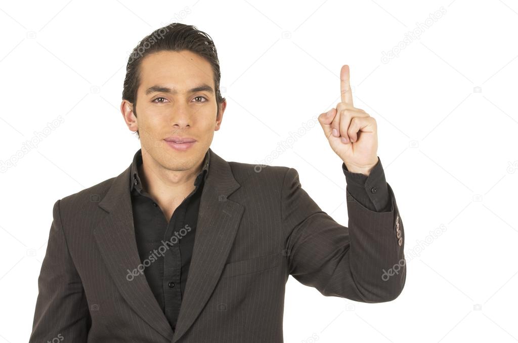 handsome young man wearing a suit posing holding finger up
