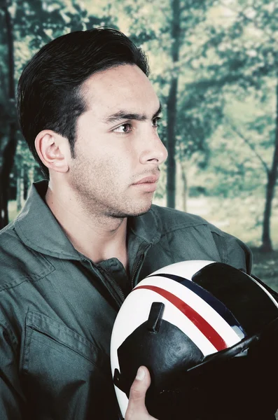 Young handsome proud pilot wearing uniform and holding helmet — Stock Photo, Image