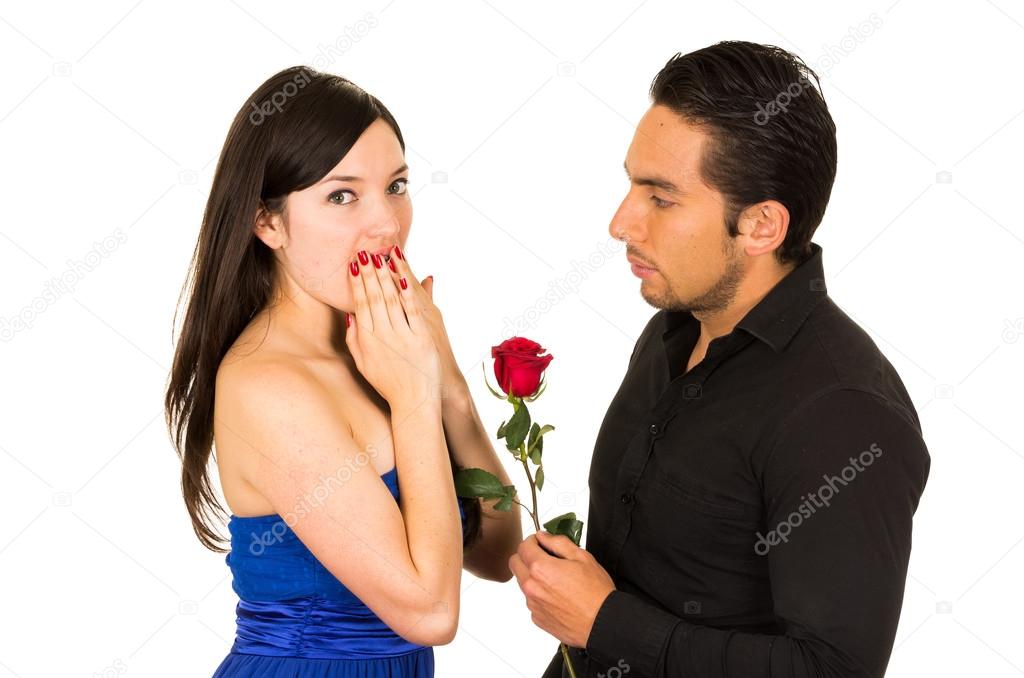 young beautiful girl receiving red rose from handsome man