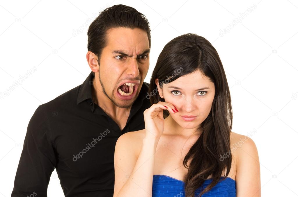 young beautiful woman crying while husband screams at her