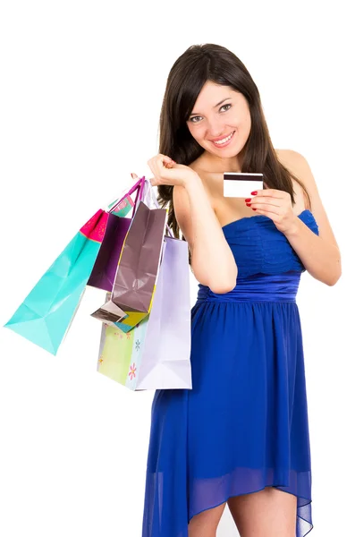 Bela jovem morena sorrindo mulher compras segurando sacos — Fotografia de Stock