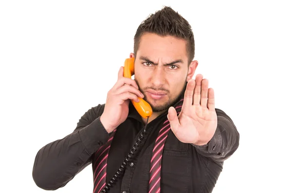 Closeup portrait of handsome hispanic man talking on corded retro phone — Stock Photo, Image