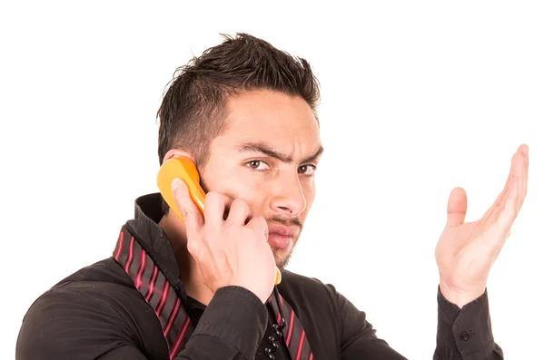 Closeup portrait of handsome hispanic man talking on corded retro phone — Stock Photo, Image