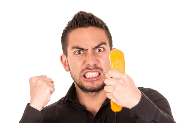 Nahaufnahme Porträt eines hübschen hispanischen Mannes, der auf schnurgebundenem Retro-Telefon spricht — Stockfoto