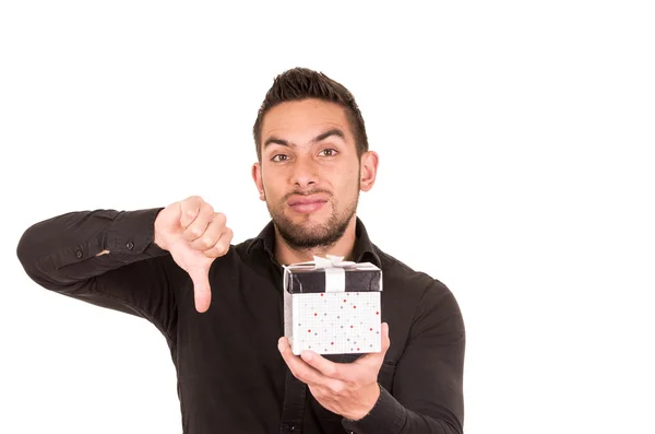 Handsome young man holding a gift box — Stock Photo, Image