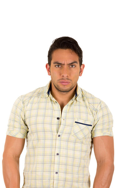 young handsome serious hispanic man with a frown