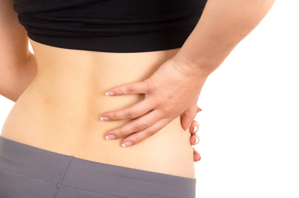 Young beautiful woman with lower back pain — Stock Image Young beautiful woman with lower back pain Royalty Free Stock Photos