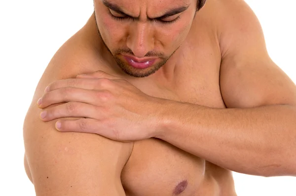 Hombre musculoso sin camisa con dolor en el hombro —  Fotos de Stock