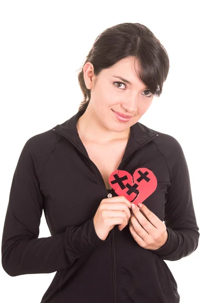 Cute young smiling latin girl holding mended heart — Stock Photo, Image