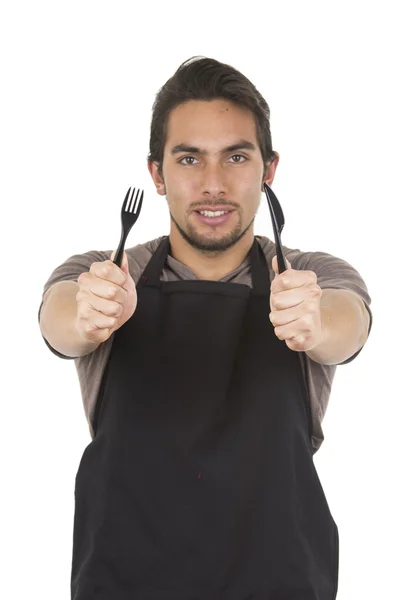 Bonito jovem chef masculino vestindo avental preto — Fotografia de Stock