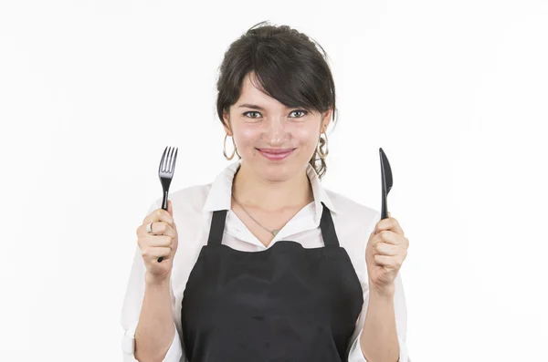 Jonge mooie vrouwelijke chef-kok zwart schort dragen — Stockfoto