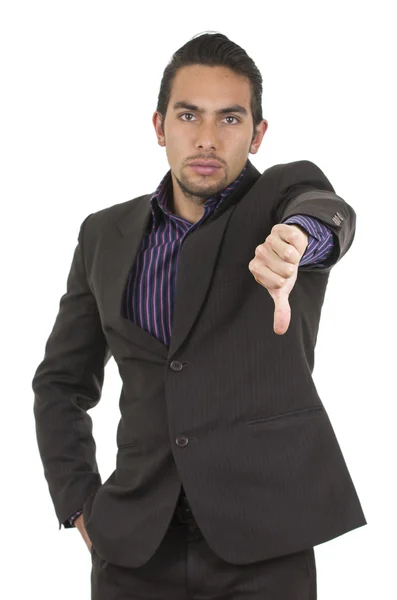 Элегантный уверенный в себе латинос в костюме жестикулирующий поражением удерживая большой палец вниз — стоковое фото