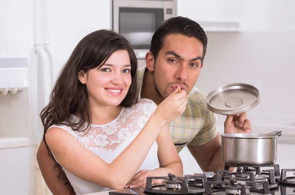Happy attractive couple cooking together — Stock Photo, Image