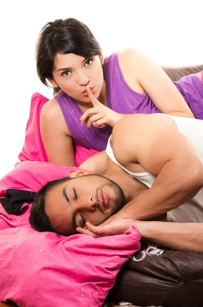 Beautiful young girl looking at her boyfriend sleeping — Stock Photo, Image