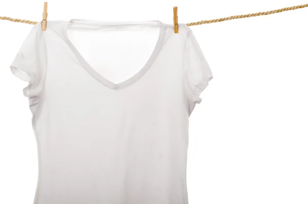 White tshirt hanging on a rope clothesline — Stock Photo, Image