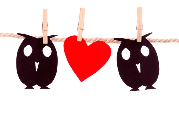 Owls and heart paper shapes hanging on a rope clothesline — Stock Photo, Image