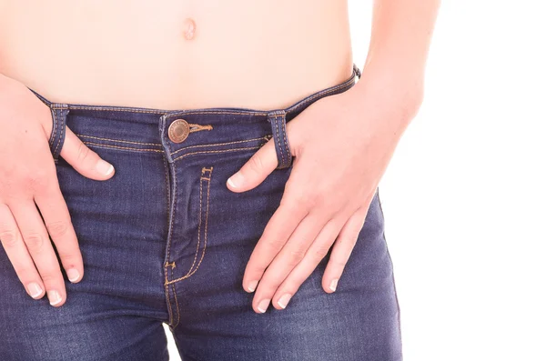 Beautiful young slim topless woman wearing jeans showing belly — Stock Photo, Image