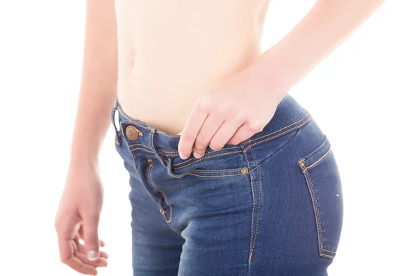 Mooie jonge slanke topless vrouw dragen van jeans tonen buik — Stockfoto