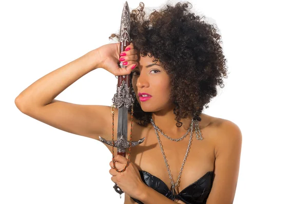 Beautiful exotic young tribal woman holding a dagger — Stock Photo, Image