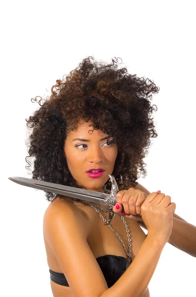 Beautiful exotic young tribal woman holding a dagger — Stock Photo, Image
