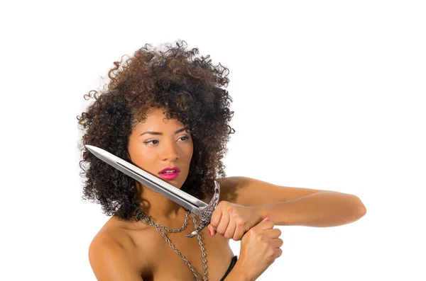 Beautiful exotic young tribal woman holding a dagger — Stock Photo, Image