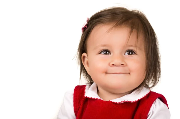 Porträtt av förtjusande brunett baby flicka klädd i röd klänning — Stockfoto