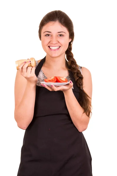 Beautiful young girl eating fresh tomatoes — Stock Photo, Image