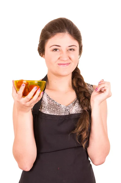 Beautiful young girl eating fresh tomatoes — Stock Photo, Image