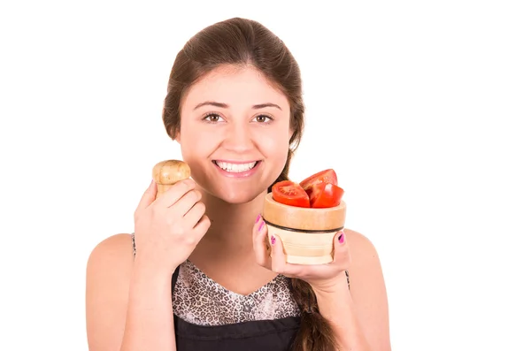 Schönes junges Mädchen isst frische Tomaten — Stockfoto