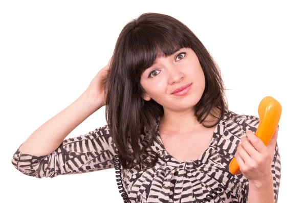 Bela jovem mulher usando telefone laranja retro — Fotografia de Stock