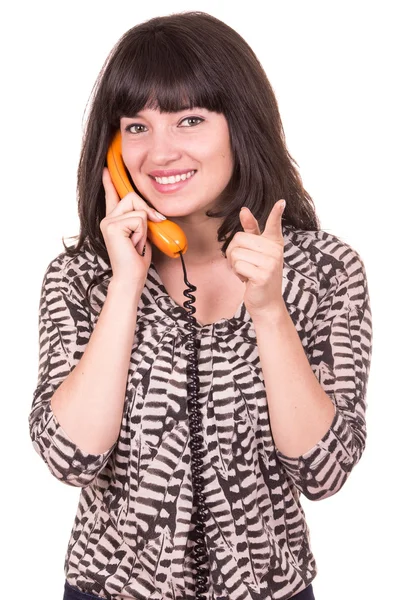 Bela jovem mulher usando telefone laranja retro — Fotografia de Stock