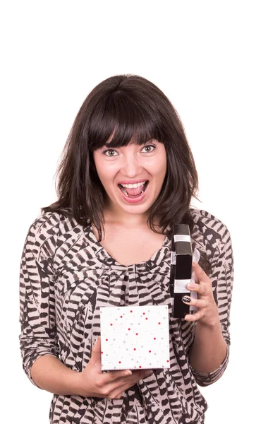 Beautiful young happy girl holding present wrapped in a box — Stock Photo, Image