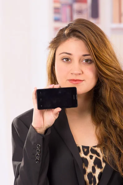 Modern beautiful young woman holding cell phone — Stock Photo, Image