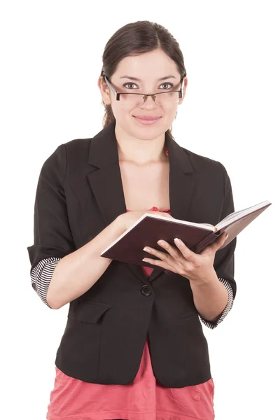 Retrato de bela professora vestindo óculos e segurando livro — Fotografia de Stock