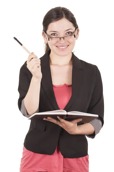 Portrait of pretty female teacher wearing glasses and holding book — Stock Photo, Image