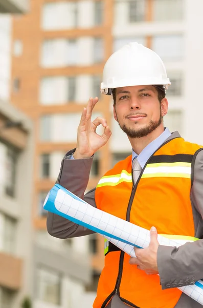 young handsome architect supervising a construction