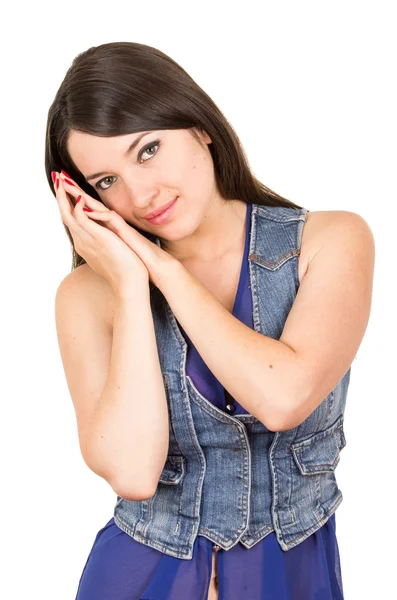 Bela jovem vestindo top de colheita azul posando com as mãos em suas bochechas — Fotografia de Stock