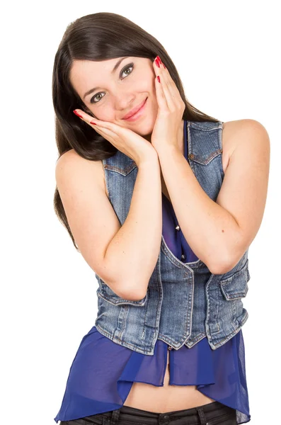 Krásná mladá dívka, která nosí modré oříznout horní pózuje s rukou na její tváře — Stock fotografie