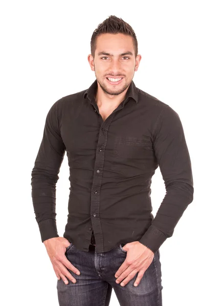 Vacker brunett ung man poserar klädd i svart tröja — Stockfoto
