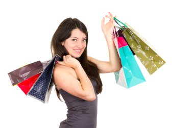 güzel genç esmer gülümseyen kadın Holding çanta alışveriş